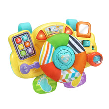 Baby driver toy front view with steering wheel panel, red light accents, and plush ring