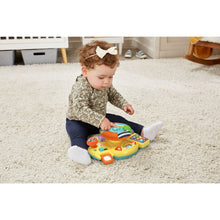 Baby driver toy on carpet with child playing, featuring colorful buttons and lights