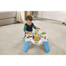Baby activity table with multi-sensory toys, blue legs and spinning activity dome