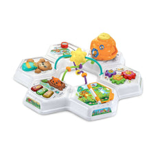 Baby activity table with toys, white top, blue legs, arch with gear and chimes