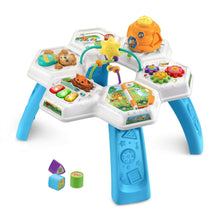 Baby activity table with orange top toy, star spinner, and touchscreen-style activity board