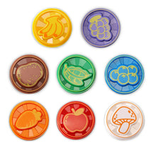 Set of colorful circular dinosaur food discs with embossed patterns