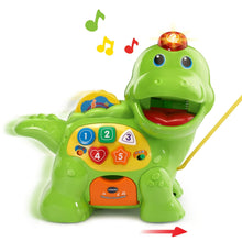 Green dinosaur learning toy with lighted head, counting panel, and small orange card slot