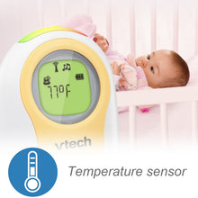 Handheld VTech digital audio monitor with green LCD showing temperature sensor graphic