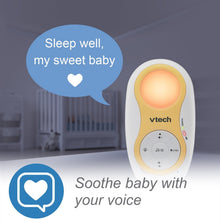 VTech baby unit with orange night light glow and white control dial on yellow front panel
