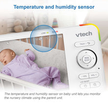 Baby monitor parent unit screen showing temperature and humidity for nursery