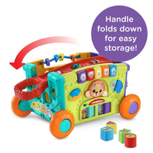 Activity wagon toy with red push handle, sorting cubes, colorful doors, and orange wheels