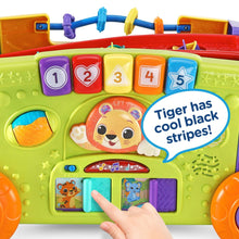 Colorful activity wagon front panel with numbered blocks, tiger graphic, and music buttons