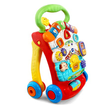 Red VTech stroll & discover activity walker with green handle and colorful toy buttons