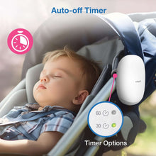 White VTech soother next to sleeping baby in rocker