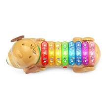 Dog xylophone with rainbow numbered tiles from 1 to 8 across the top