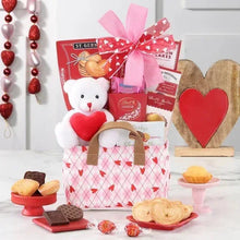 Valentine gift tote with brown handles, white teddy and red heart, candy boxes and pink bow