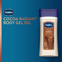 Vaseline cocoa radiant body gel oil bottle with purple cap on blue background
