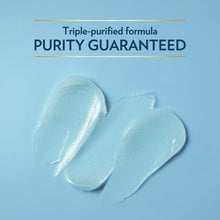 Pale petroleum jelly dollops with spread texture on flat surface