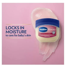 Vaseline Baby Healing Jelly jar beside pink cream dollop