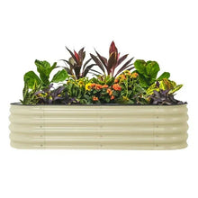 White metal raised garden bed planter with mixed greenery and small orange flowers