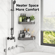 Wall-mounted corner shower organizer with two shelves holding bottles, charcoal gray