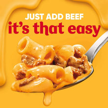 Cheesy macaroni with beef on a spoon, ready for one-pan cooking