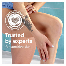 Woman applying a Venus razor on her leg with shaving foam