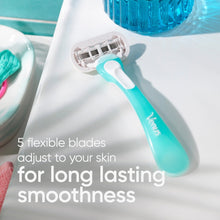 Women’s blue disposable razor with 5 flexible blades, positioned near sink