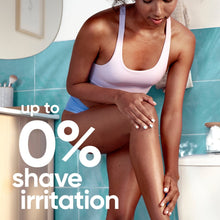 Manual razor shaving on leg with aqua handle and pivoting head during use