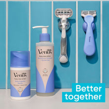 Venus razor kit items arranged together on a blue background, including razor and bottle.