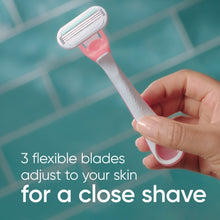 Gillette Venus Smooth Sensitive pink disposable razor with three flexible blades in hand