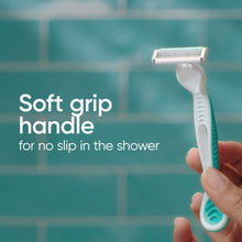 Disposable razor with soft-grip handle, light blue and white, close-up