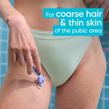 Venus razor shaving the pubic area near light green bikini underwear.