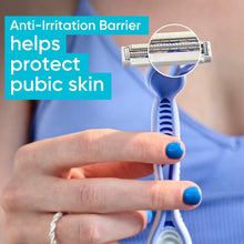 Women's Venus razor with blue handle, close-up held in hand.