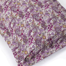 Quilted comforter with lilac base and multicolor floral medallion print