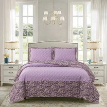 Quilt set with lilac floral print comforter, two matching pillow shams, bed-ready style