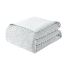Folded gray comforter with smooth top and textured sides