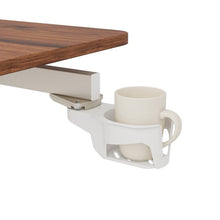 Versalift desk's attached white cup holder beside the wood-grain tabletop