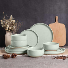 Speckled ceramic dinnerware set in pale mint green, plates and bowls