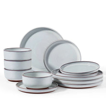 Ceramic dinnerware set with plates and bowls, pale blue-gray with reddish rim