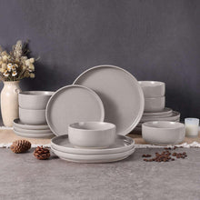 Light gray stoneware dinnerware set with round plates and bowls