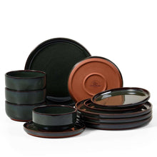 Dark speckled ceramic dinnerware set with stackable plates and bowls, green and black tones