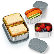 Grey stainless steel bento lunch container set with grey silicone lids, open compartments with food