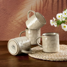 Ceramic coffee mug set of 4 in light beige with curved handles and wave texture