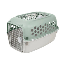 Light green and white plastic pet kennel with front wire door and side vent panels