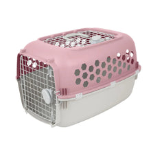 Pink plastic pet kennel with top ventilation grille and hex side openings, side door.