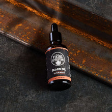 Viking Revolution beard oil bottle with sandalwood label, angled view