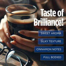 Dark roast coffee mug with crema, with a hand holding the cup
