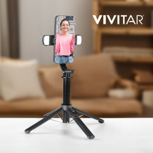 Black selfie stick tripod with phone mount and quad LED lights on three-leg base