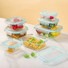 Glass meal prep containers set with airtight lids, turquoise trim; assorted colorful contents