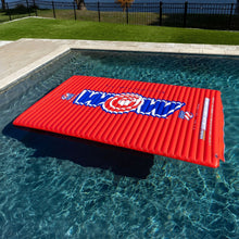 WOW Sports red inflatable water walkway on pool water with blue-white logo