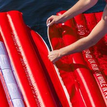 Hands on WOW Sports red inflatable walkway edge, water splashing