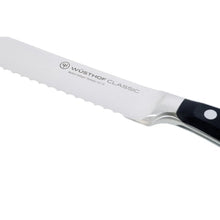 WÜSTHOF Classic serrated knife blade with stamped logo and black handle