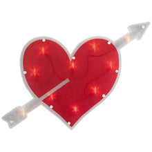 Red heart window silhouette with white trim, crossed arrows, and glowing LED lights